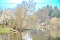 Panoramic view of river with emerald water and boats in the early spring Royalty Free Stock Photo