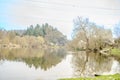 Panoramic view of river with emerald water and boats in the early spring Royalty Free Stock Photo