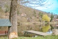 Panoramic view of river with emerald water and boats in the early spring Royalty Free Stock Photo