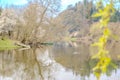 Panoramic view of river with emerald water and boats in the early spring Royalty Free Stock Photo