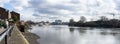 Panoramic view of river Thames toward the City, from Thames path, near Hammersmith. London, England, March 2017. At low tide