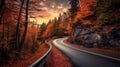 Panoramic view of a winding road amidst a vibrant autumn landscape. Royalty Free Stock Photo