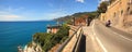 Panoramic view on road along the sea. Royalty Free Stock Photo