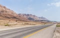 Panoramic view of the road, coast of Dead Sea and mountains in the Judean Desert in the Dead Sea region in Israel