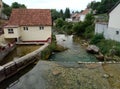 Rocks, houses and Duman, the spring of the Bistrica River in the small town of Livno in Bosnia and Herzegovina