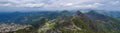 Panoramic view from Rohac peak on Western Tatra mountains or Rohace panorama with hiking trail on ridge. Sharp green