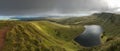 A panoramic view of the rolling vivid green hills and mountains of the Brecon Beacons in Wales with a lake in the foreground. Royalty Free Stock Photo