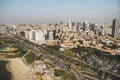 Panoramic view on roofs of Tel-Aviv, Israel. Modern buildings and sandy beach of Tel Aviv at skyscape background. Urban life, Royalty Free Stock Photo