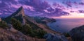 Dramatic Purple Sunrise over a Majestic Coastal Mountain Landscape Royalty Free Stock Photo