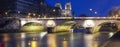 Panoramic view of Saint-Michel bridge and the Seine River at night, Paris, France. Royalty Free Stock Photo