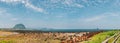 Panoramic view of Sanbangsan Mountain and beach, Jeju Olle Trail in Jeju Island, Korea