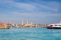 Seascape with motor yachts in marina. View of mosque in the background. Hurghada, Egypt Royalty Free Stock Photo