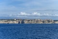 Panoramic view from the sea to the white limestone cliffs and the city of Bonifacio Corsica of the sea and blue sky Royalty Free Stock Photo