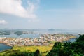 Panoramic view of seaside village from Seongsan Ilchulbong Tuff Cone in Jeju Island, Korea Royalty Free Stock Photo