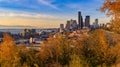 Panorama of Seattle downtown skyline at sunset in the fall with yellow foliage in the foreground from Dr. Jose Rizal Park Royalty Free Stock Photo