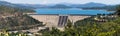 Panoramic view of Shasta Dam on a sunny day, Shasta mountain visible in the background; Northern California Royalty Free Stock Photo