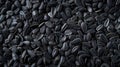 A panoramic view showcases the texture of black sunflower seeds, offering a captivating background. Ai Generated Royalty Free Stock Photo