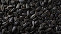 A panoramic view showcases the texture of black sunflower seeds, offering a captivating background. Ai Generated Royalty Free Stock Photo