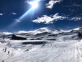 Panoramic view of ski resort, slope, people on the ski lift, skiers on the piste in Valle Nevado