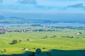 Panoramic view of a small village on green meadow in the Alps in Germany in the morning Royalty Free Stock Photo