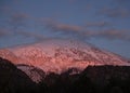 Panoramic view Snow-capped peaks of mount Dirfys spruce forest at sunset on a background of clouds on the island of Evia Euboea Royalty Free Stock Photo