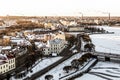 Panoramic view of the snow-covered city Vyborg of choice facades of houses on the background of industrial steam from the pipes