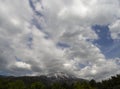 Panoramic view of snow covered mountain Dirfys, church and sky with clouds on on the island of Evia, Greece Royalty Free Stock Photo