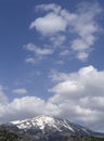 Panoramic view of snow covered mountain Dirfys, church and sky with clouds on on the island of Evia, Greece Royalty Free Stock Photo