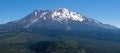 Panoramic view of the snow covered summit of Shasta mountain on a sunny summer day, California