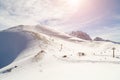 Panoramic view of the snow mountain and the chair ski lift on a sunny winter day Royalty Free Stock Photo