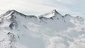 Panoramic view of snowy mountains at alpine ski resort in Livigno, Italy. Snow mountain range landscape on winter day. Royalty Free Stock Photo