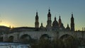 Panoramic view of the stone bridge and the Basilica del Pilar at sunset in Zaragoza, Spain Royalty Free Stock Photo