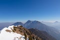 Panoramic view from summit of Freiberg on snow capped mountain peak Hochobir in Karawanks, Julian Alps, Carinthia, Austria. Royalty Free Stock Photo