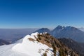 Panoramic view from summit of Freiberg on snow capped mountain peak Hochobir in Karawanks, Julian Alps, Carinthia, Austria. Royalty Free Stock Photo