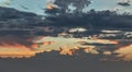 Panoramic view of The sun shines through the clouds in the sunset sky with dramatic light. The shape of the clouds evokes Royalty Free Stock Photo