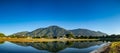 Panoramic view of a sunrise at Parque del Este With El Avila. Royalty Free Stock Photo