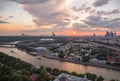 Panoramic view of sunset above Moscow city and cloud reflections in river with traveling boats Royalty Free Stock Photo