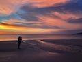 Panoramic view of sunset a man taking photo at Karon beach in Phuket, Thailand Royalty Free Stock Photo