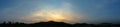 Panoramic view of sunset sky and clouds at hill and lake Royalty Free Stock Photo