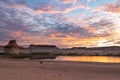 Panoramic view at sunset on solitary rock formations Lone Rock in Wahweap Bay, Glen Canyon Recreation Area, Page, Utah, USA Royalty Free Stock Photo