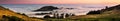 Panoramic view at sunset of valley covered in a sea of clouds in the Santa Cruz mountains, San Francisco bay area, California Royalty Free Stock Photo