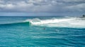 Panoramic View of Surfers Catching Waves at the World-Famous Surfing Spot, Waimea Bay, Hawaii Royalty Free Stock Photo