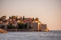 Panoramic view of Sveti Stefan in Montenegro at pink sunset. Famous tourist place near Budva Natural Royalty Free Stock Photo