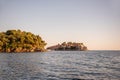 Panoramic view of Sveti Stefan in Montenegro at pink sunset. Famous tourist place near Budva Natural Royalty Free Stock Photo