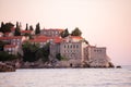 Panoramic view of Sveti Stefan in Montenegro at pink sunset. Famous tourist place near Budva Natural Royalty Free Stock Photo