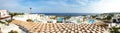Panoramic view on swimming pool and beach at luxury hotel Royalty Free Stock Photo