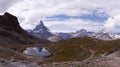 Panoramic view of Swiss Alps with Matterhorn and Riffelsee Lake on the left Royalty Free Stock Photo