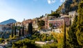 Panoramic view of Taormina historic old town with residential estates over Ionian sea shore in Messina region of Sicily in Italy Royalty Free Stock Photo