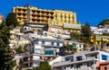 Taormina houses and residences on slope of Monte Tauro rock over Ionian Sea shore in Messina region of Sicily in Italy