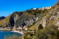 Taormina shore with Castello Saraceno castle, Giardini Naxos and Villagonia towns in Messina region of Sicily in Italy
